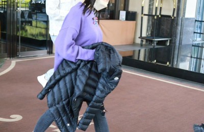 Wearing a purple sweatshirt and ponytails (transforming into a college student)