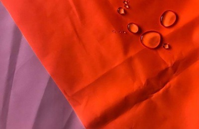 Aramid carrier dyeing