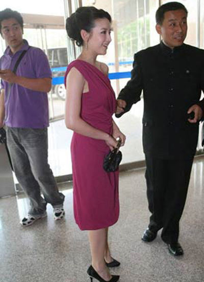 Purple and white off-shoulder jumpsuit  The dress is sexy yet elegant.